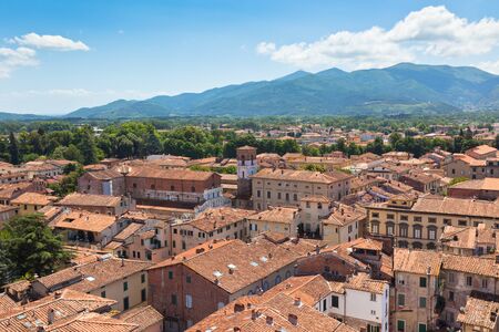 View over Italian town Lucca with typical terracotta roofsの写真素材