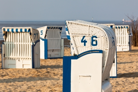 Beach wicker chairs strandkorb in Northern Germany. North seaの写真素材