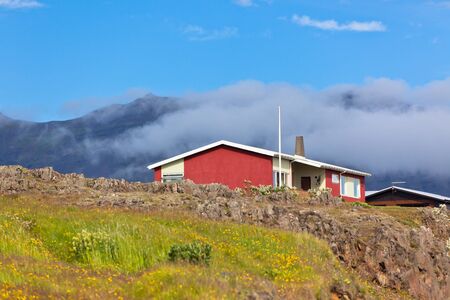 Red Small House in East Iceland. Horizontal shotの写真素材