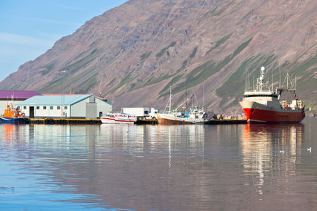 Typical Iceland Harbor with Fishing Boats in Sunny Summer Dayのeditorial素材