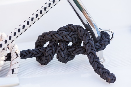 Black Boater Rope Knot on White deck backgroundの写真素材