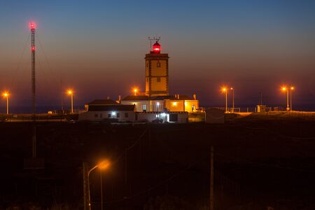 Night shot of Cape Carvoeiro lighthouse in Peniche, Portugal. Horizontal shotの写真素材