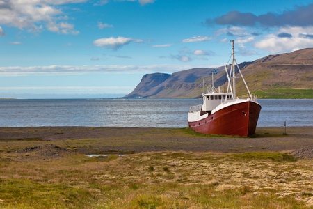 An old fishing vessel that shipwrecked on the northern coast of Iceland in the Westfjords regionの写真素材