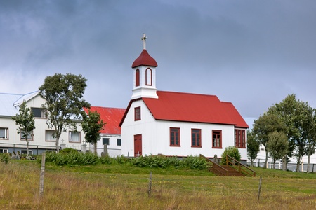 Typical Rural Icelandic church in siding house at overcast dayの写真素材