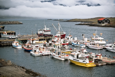 Typical Iceland Harbor with Fishing Boats at Overcast Dayの写真素材