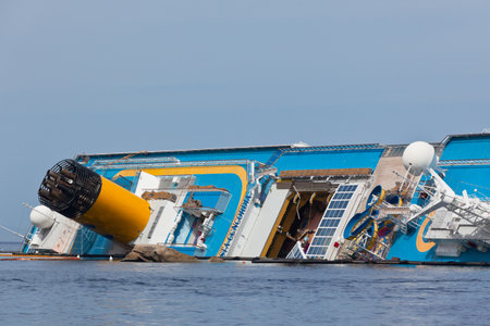 GIGLIO, ITALY - APRIL 28, 2012  Costa Concordia Cruise Ship at Italian Giglio Island Coastline after Shipwreck at January, 13, 2012  The ship, carrying 4,252 people from all over the world, was on the first leg of a cruise around the Mediterranean Sea, stのeditorial素材