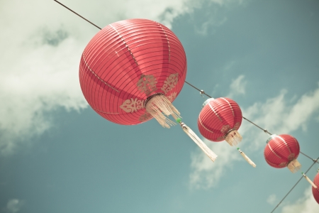 Red Chinese Paper Lanterns against a Blue Sky  Horizontal filtered shotの写真素材