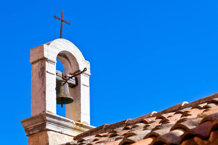 Croatian Church Roof on bright blue sky backgroundの写真素材