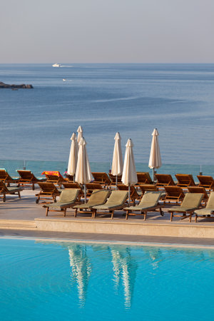 Hotel Poolside Chairs with Sea view  Vertical shotのeditorial素材