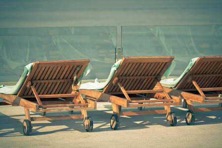 Hotel Poolside Chairs with Sea view  Horizontal vintage style shotの写真素材