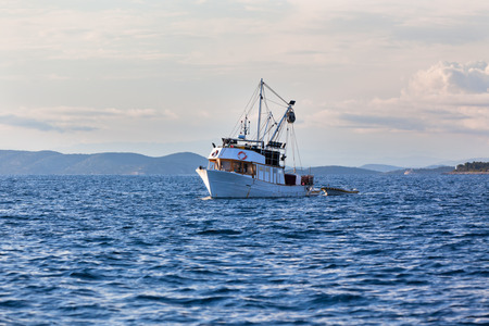 Old fishing boat in the Adriatic sea. Horizontal shot