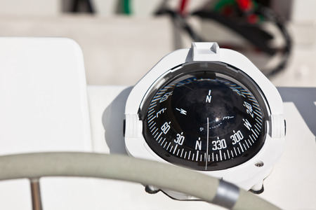Sailing yacht compass and control wheel. Horizontal close up shotの写真素材