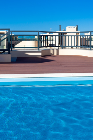 Outdoor swimming pool at a house roof. Vertical shotの写真素材