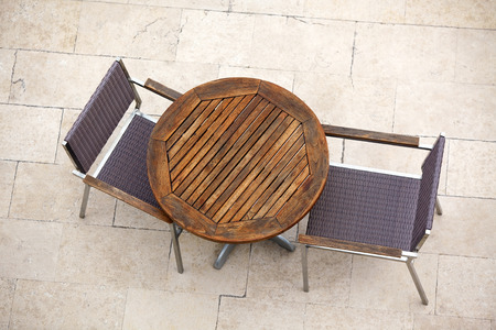 Outdoor summer cafe tables with chairs. View from above. Copy spaceの写真素材