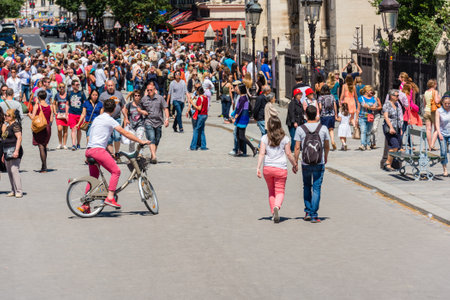 FRANCE, PARIS - JUNE 06: Hordes of tourists on a street of Paris, France on June 06, 2015.のeditorial素材