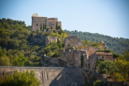 View of Saint Saturnin les Apt, Provence, France. Castle ruins on a hill above the villageのeditorial素材