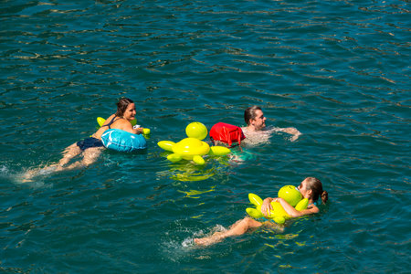SWITZERLAND, ZURICH - AUGUST 22: 51st Zurich Limmat Swim on August 22, 2015. People have fun participating the swimming summer festival.のeditorial素材
