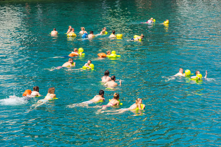SWITZERLAND, ZURICH - AUGUST 22: 51st Zurich Limmat Swim on August 22, 2015. People have fun participating the swimming summer festival.のeditorial素材