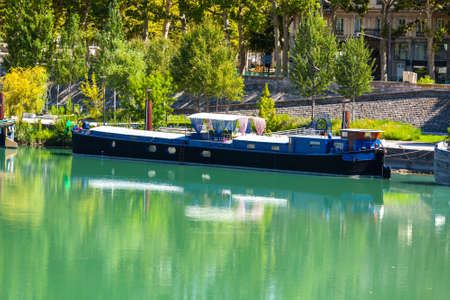 View of houseboats on the river in Lyon, France. Summer day shotの写真素材