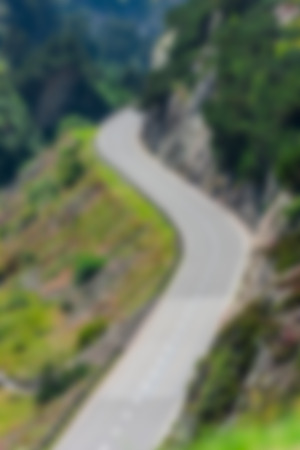 Road Turn in Swiss Mountains. Defocused blur shot