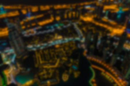 Dubai downtown night scene with city lights. Defocused blur top viewの写真素材