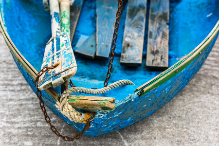 Old blue wooden shabby fishing boat detail. Shot with a selective focusの写真素材