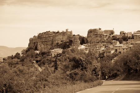 Saignon village view in Provence, France. Summer landscape. Sepia toned shotの写真素材
