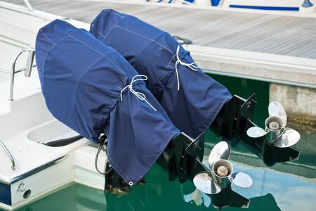 two motor boat screws horizontal day shotの写真素材