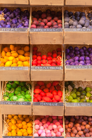 Exotic scented wooden balls for sale in French marketplace. Scents titles in Frenchの写真素材