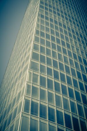 Office glass skyscraper building. Vertical filtered shotの写真素材