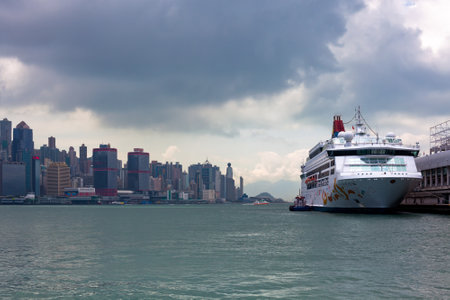HONG KONG, HONG KONG - SEPTEMBER 22: cruise ship on Victoria harbor in Hong Kong with tall buildings on September 22, 2012のeditorial素材
