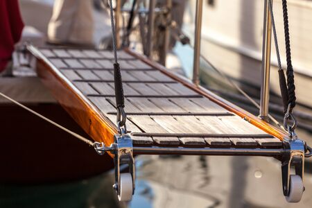 wooden gangway on marine yacht staying in port. luxury tourism