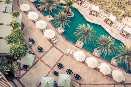 Hotel Poolside with Parasols and Palms. Top view shotのeditorial素材