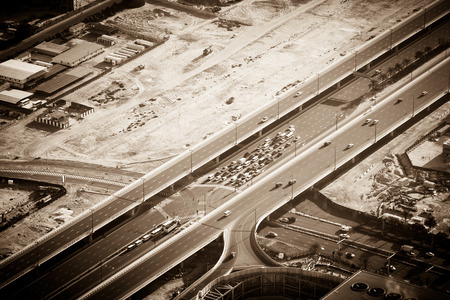 Top view of highway interchange in Dubai, UAE. Sepia toned