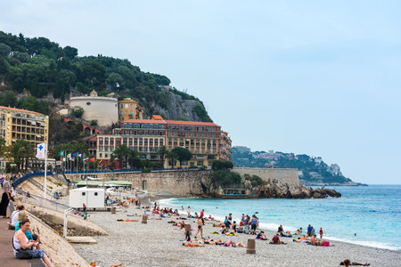 FRANCE, NICE - JUNE 13: people on the beach of the Mediterranean sea. Cote d Azur, Nice, France on June 13, 2015のeditorial素材