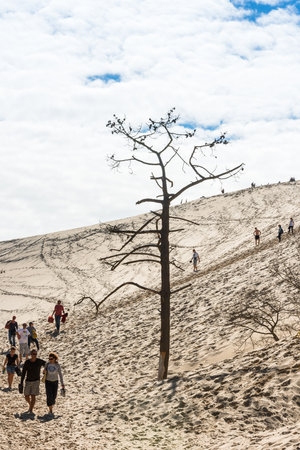 FRANCE, LA TESTE-DE-BUCH - SEPTEMBER 19: people visiting the famous highest sand dune in Europe Dune of Pyla on September 19, 2015のeditorial素材