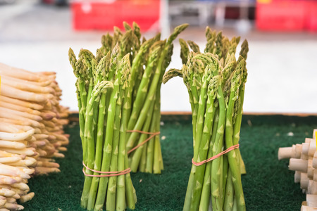 Fresh asparagus selling in a farmers market. Shot with a selective focusの写真素材