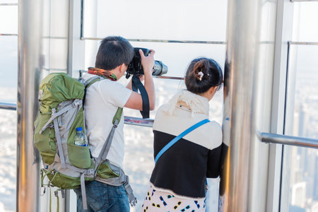 DUBAI, UAE - JANUARY 02: people at the top the observation deck of the highest building in the world Burj al Khalifa on January 02, 2015 in Dubai, United Arab Emiratesのeditorial素材