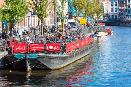 NETHERLANDS, AMSTERDAM - OCTOBER 2: bicycle parking on an old tour boat in Amsterdam on October 2, 2015のeditorial素材
