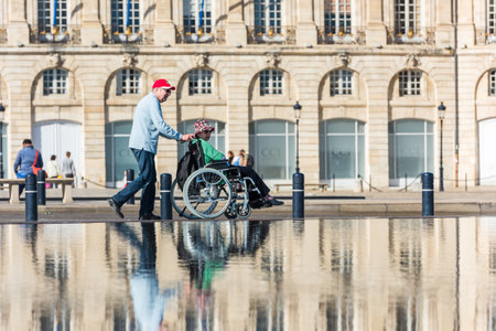 FRANCE, BORDEAUX - SEPTEMBER 20: People visiting a mirror fountain in front of Place de la Bourse in Bordeaux, France on September 20, 2015のeditorial素材
