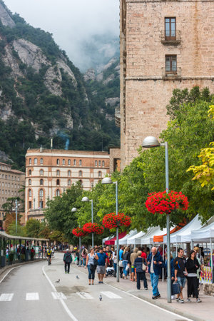 SPAIN, MONTSERRAT - SEPTEMBER 11: Tourists enjoy visiting Montserrat monastery on September 11, 2015のeditorial素材