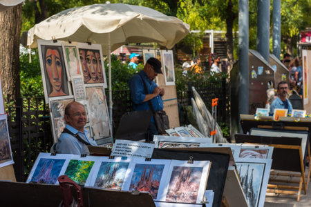 SPAIN, BARCELONA - SEPTEMBER 13: Paintings for sale on Barcelona street on September 13, 2015のeditorial素材