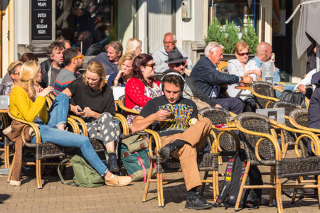 FRANCE, PARIS - JUNE 02: Parisians and tourists enjoy food and drinks in cafe sidewalk in Paris France on June 02, 2015.のeditorial素材