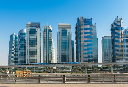 UAE, DUBAI - DECEMBER 31: view of Jumeirah Lakes Towers  and metro bridge in Dubai, United Arab Emirates on December 31, 2014のeditorial素材