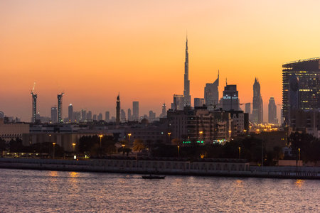 UAE, DUBAI - DECEMBER 27: view of Dubai cityscape from Dubai creek bank at night on December 27, 2014のeditorial素材