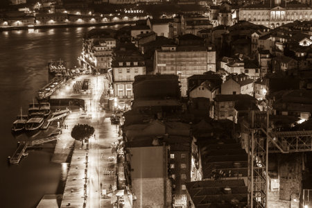 PORTUGAL, PORTO - JANUARY 20: Overview of Old Town of Porto, Portugal at night. Ribeira and Douro river on January 20, 2013のeditorial素材