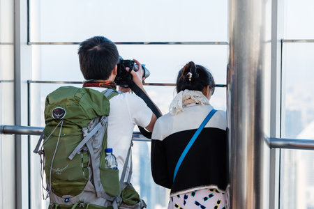DUBAI, UAE - JANUARY 02: people at the top the observation deck of the highest building in the world Burj al Khalifa on January 02, 2015 in Dubai, United Arab Emiratesのeditorial素材