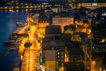 PORTUGAL, PORTO - JANUARY 20: Overview of Old Town of Porto, Portugal at night. Ribeira and Douro river on January 20, 2013のeditorial素材
