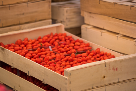 Natural organic strawberries in boxes at a farmers marketの写真素材