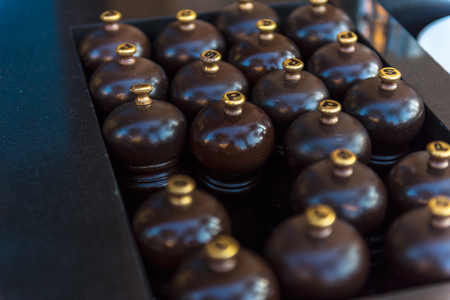 Number of wooden mills with salt and pepper in a restaurant. Shot with a small GRIPの写真素材